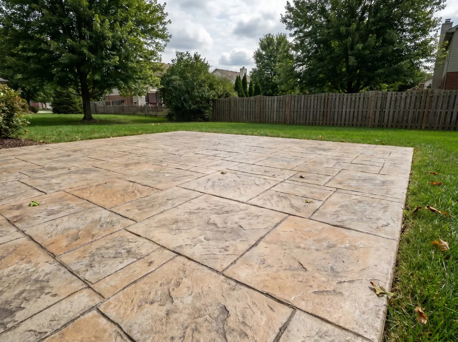 A stamped concrete patio finished to look like natural stone